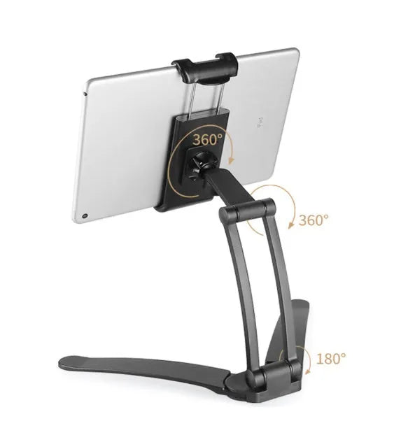 Silver aluminium alloy desktop tablet stand with adjustable holder and white mounting base on a wooden table.