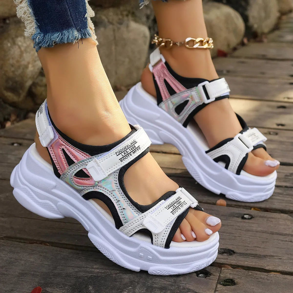 Women's white Roman platform sports sandals with strapped PU upper on a rubber sole.