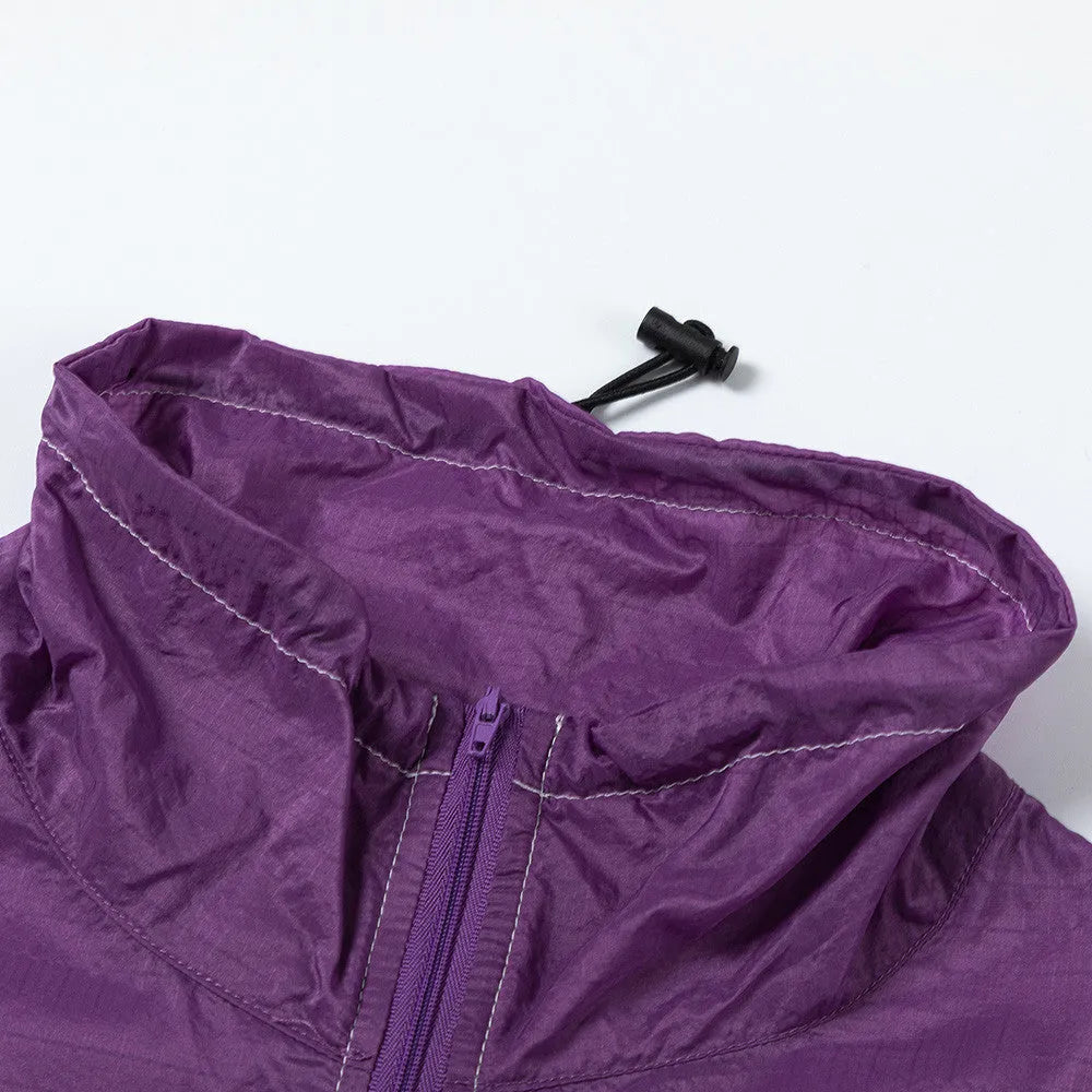 Men's thin loose sun protection jacket in black nylon fabric with pockets, worn casually outdoors