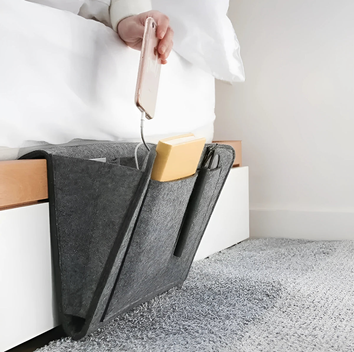 Felt bed storage bag with pocket in beige on a bed, small size 28x24cm, anti-slip organiser for mattress or sofa