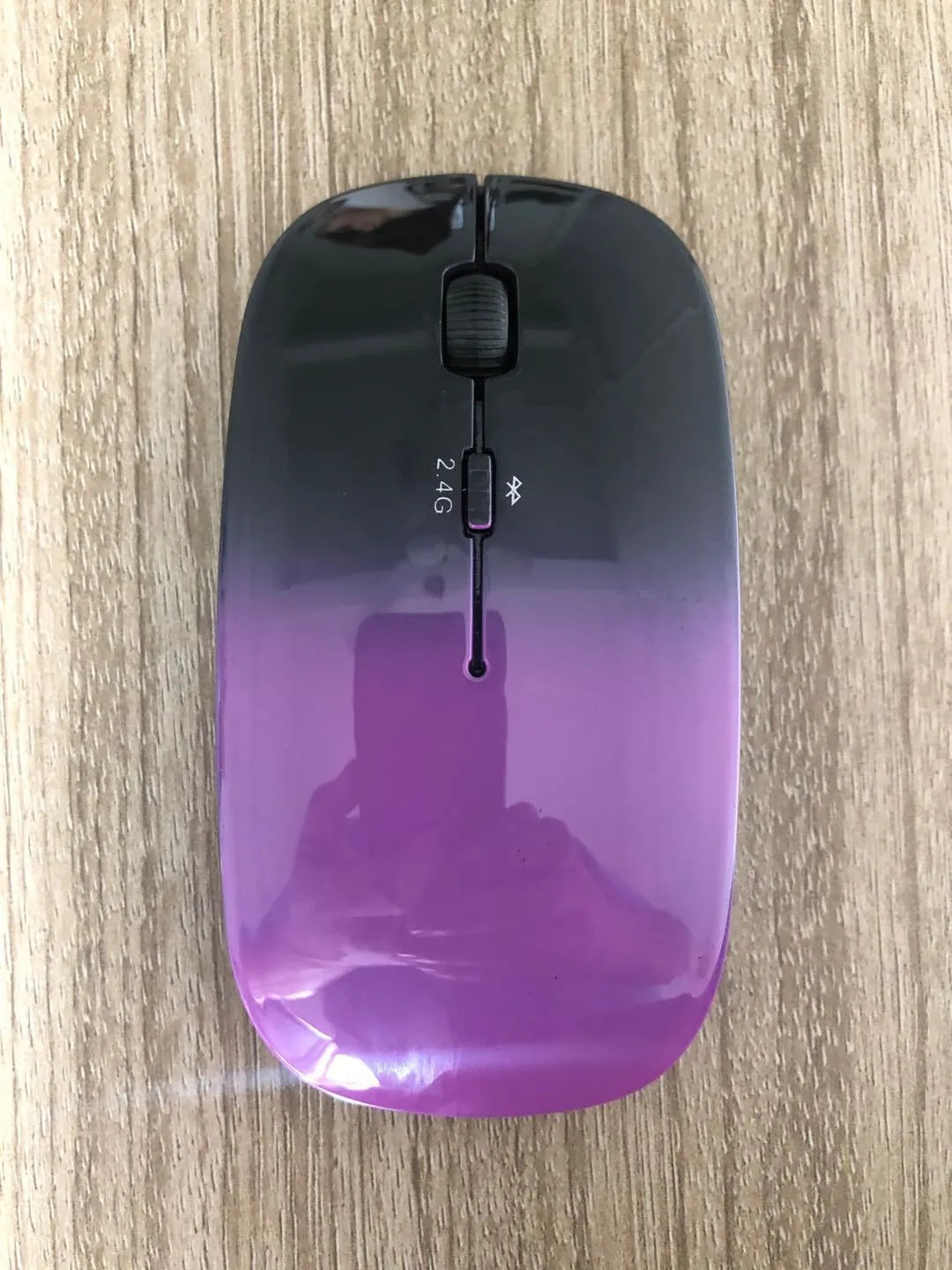 Wireless Bluetooth dual mode mouse in black with three buttons and four-way roller