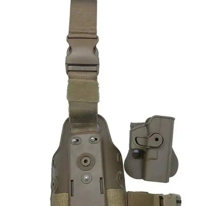 Green tactical plastic leg holster attached to a waist plate, showing quick-pull opening.