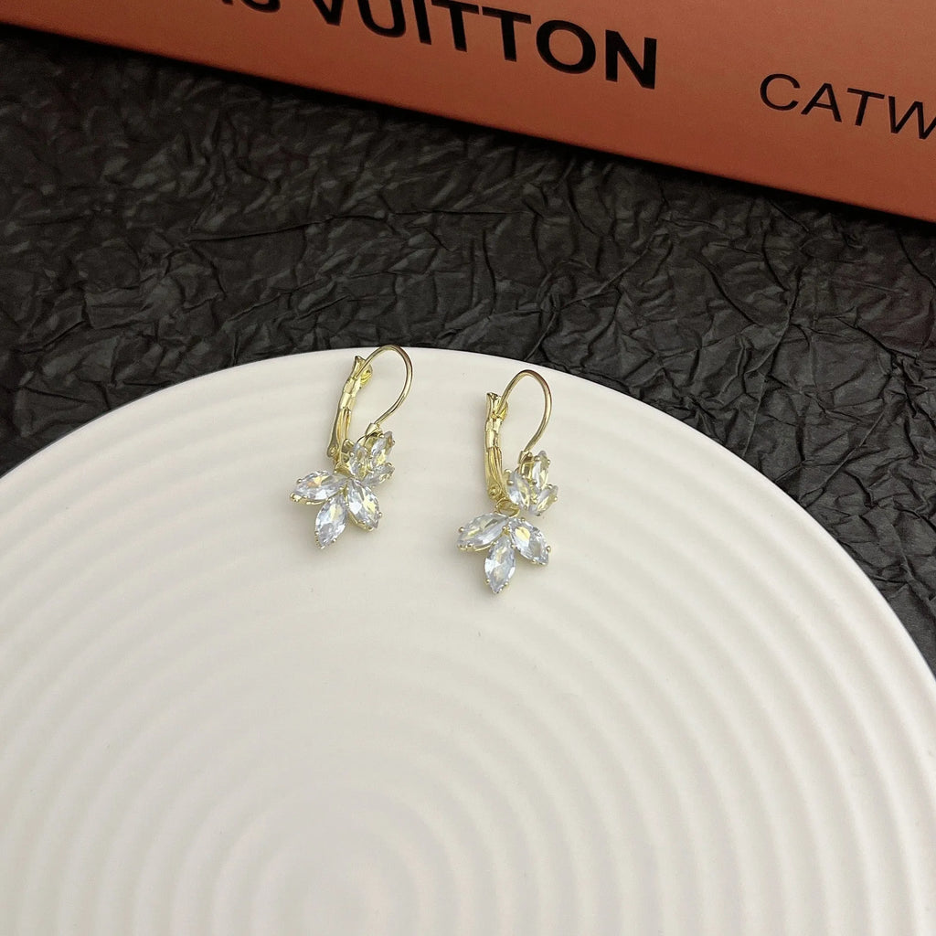 Women's platinum alloy earrings with leaves shape and inlaid zircon stones