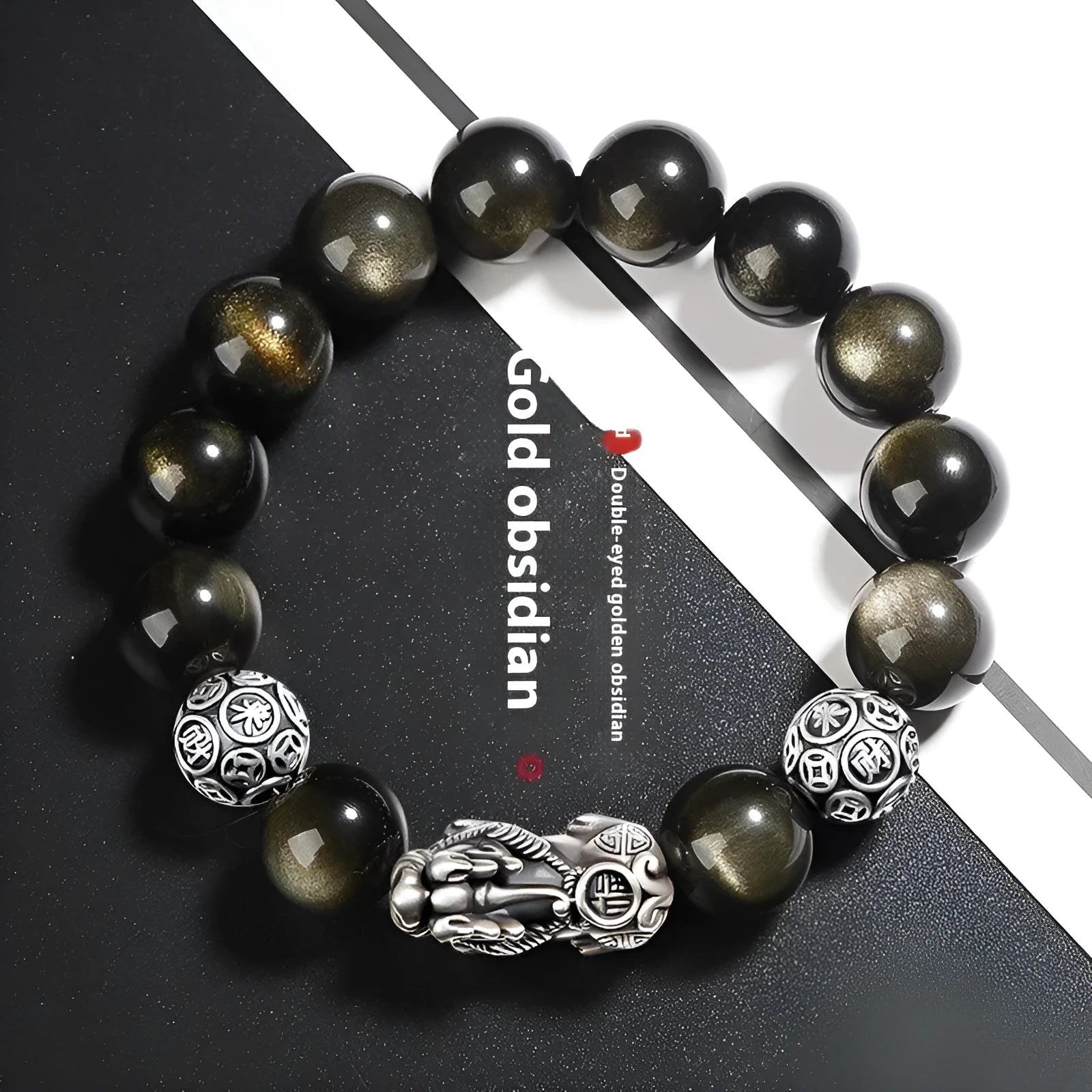 Men's geometric obsidian and sterling silver bracelet showing polished stones and metallic framework