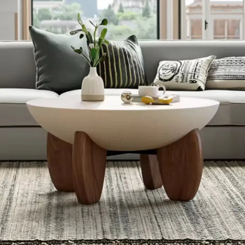White solid wood coffee table with adjustable height and storage, set in a living room