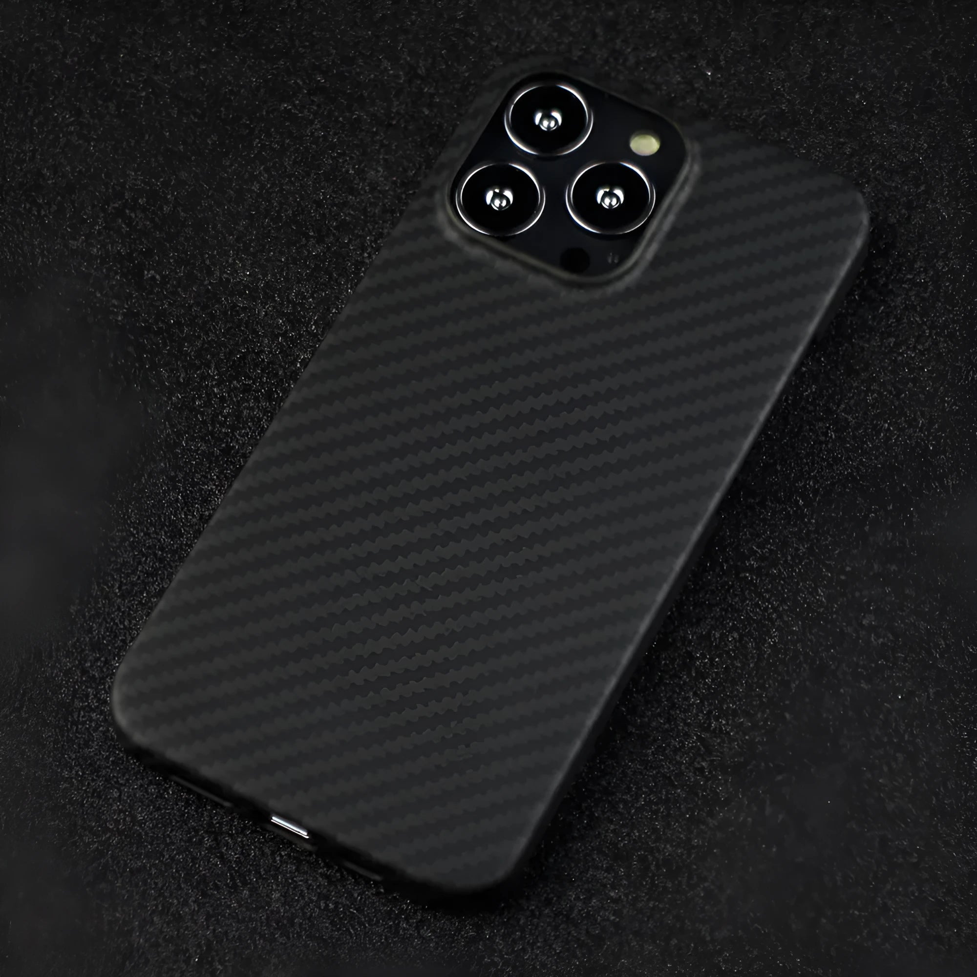 Matte black Kevlar fibre protective case for iPhone showing stripe detail and precise model fit
