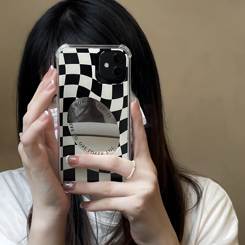 Mirror phone case with chessboard plaid pattern against black background