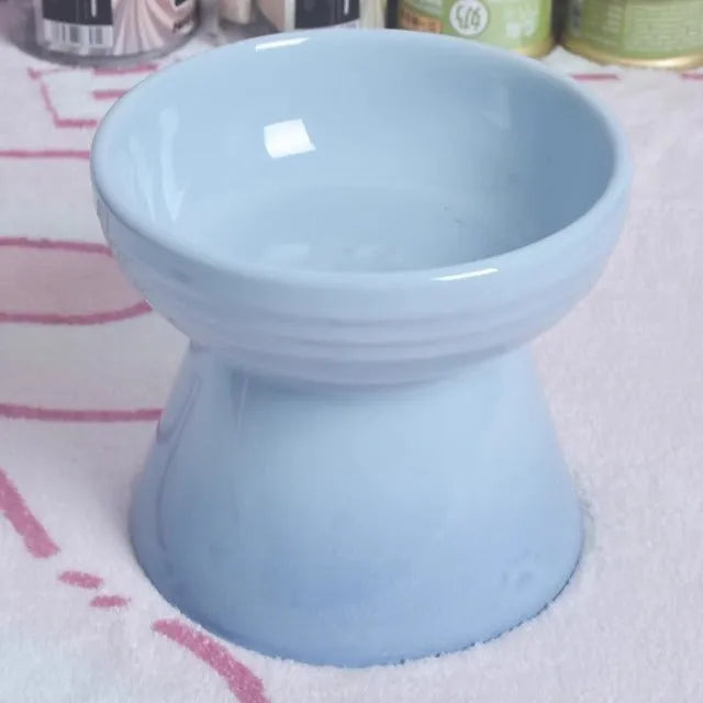 Black ceramic pet bowl with a high foot and neck protector to prevent tipping, shown with flat and slanted rim options.