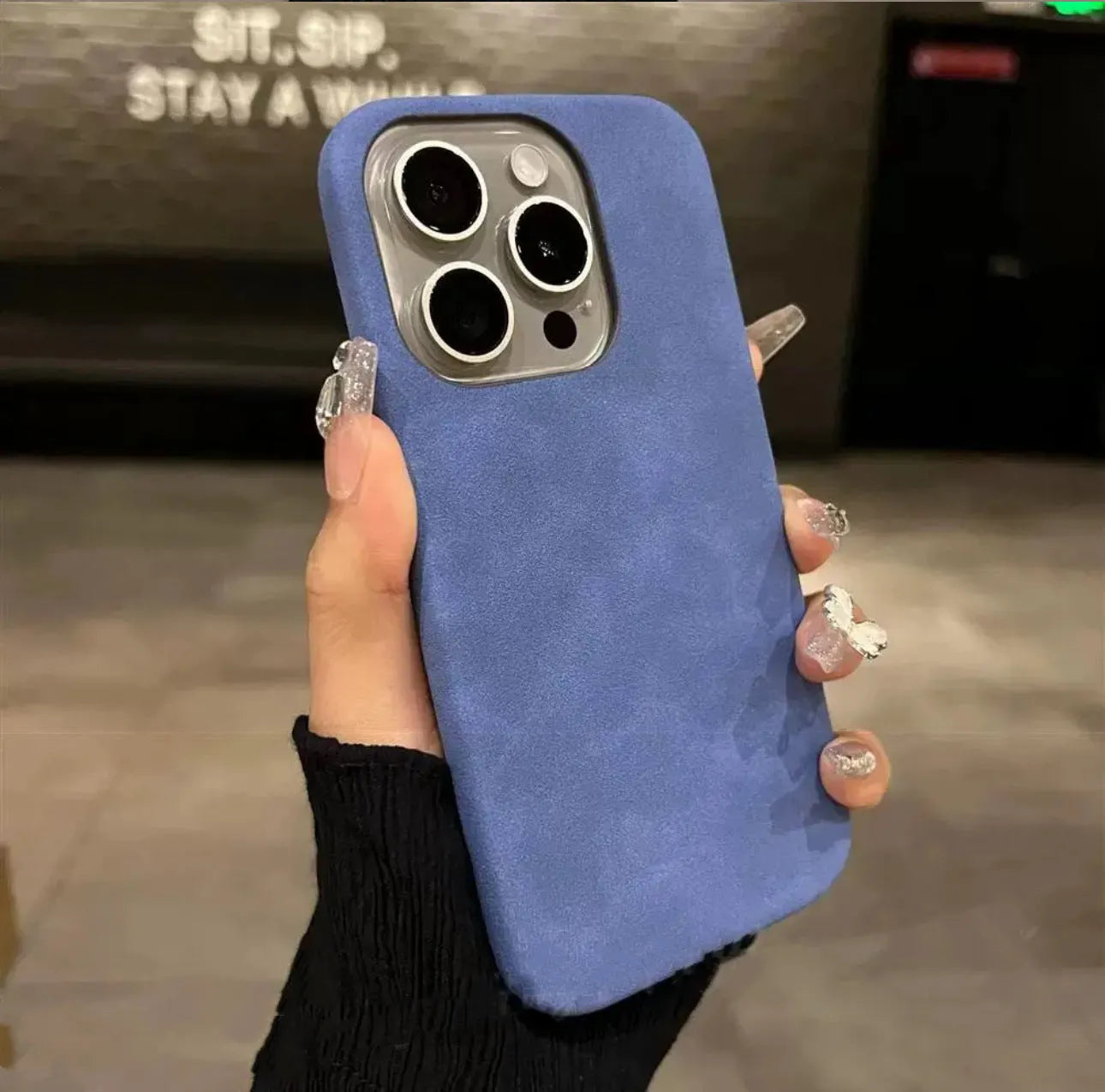 Solid colour suede imitation leather iPhone case in half-pack design showing shockproof protection features
