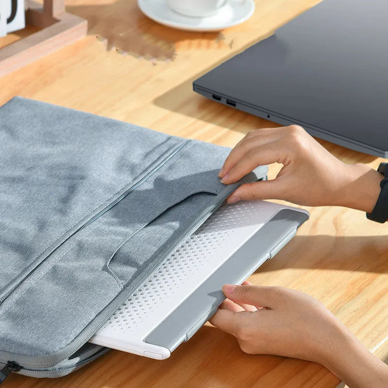 Dongdong portable alloy notebook stand with laptop placed on it, black colour