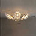 Simple modern ceiling flower lamp with white flowers and 5 heads emitting warm light in a living room