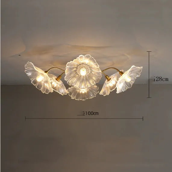 Simple modern ceiling flower lamp with white flowers and 5 heads emitting warm light in a living room