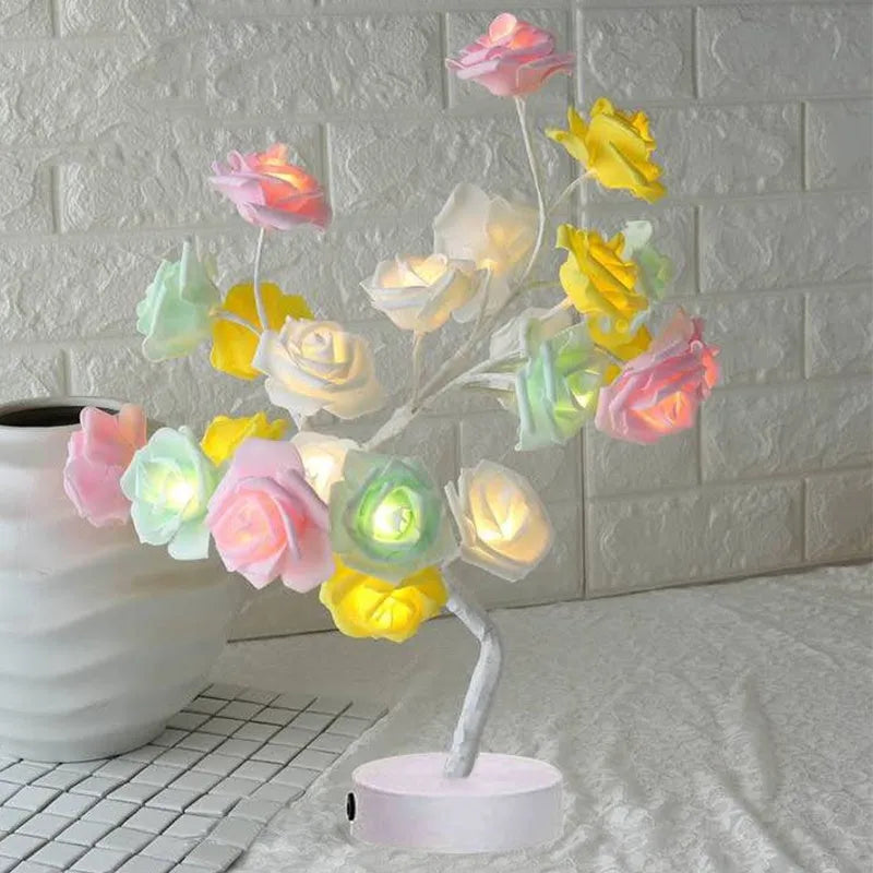 White and red rose flower LED table lamp with bonsai tree lights on a table.