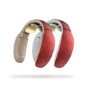 Small red and white intelligent cervical massager unit with three contact points and battery power.