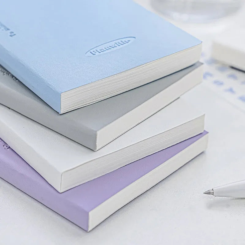Embossed simple visual daily meter book notebook open, showing white 100g paper, available in blue, grey, purple, white, and protective cover colours.
