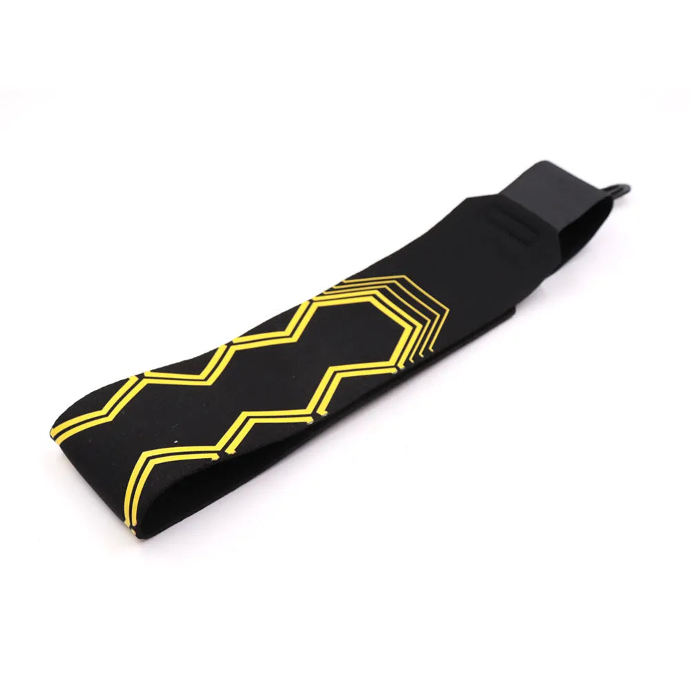 Black soccer training tether with adjustable waist belt and elastic Velcro strap on a green grass field