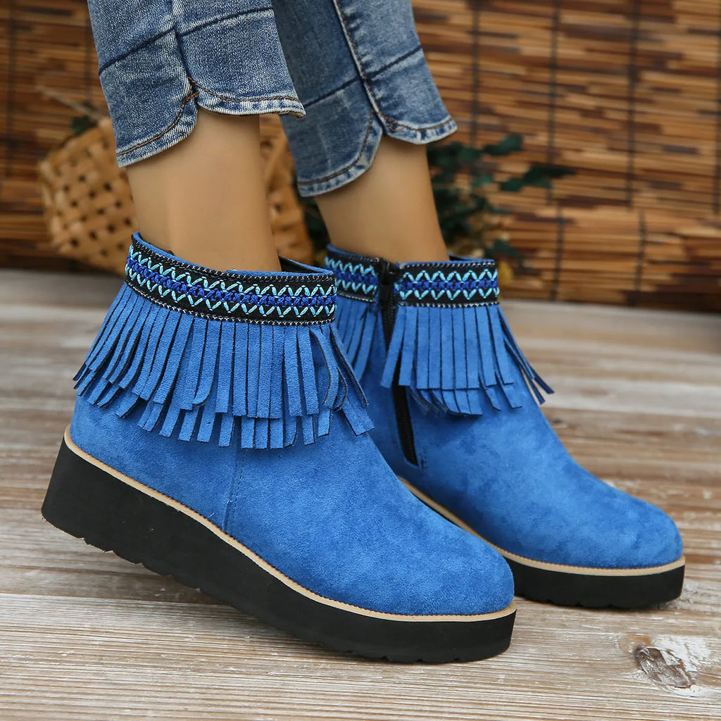 Women's suede wedge ankle boots with side zipper, thick rubber sole, and tassel detailing in dark brown colour