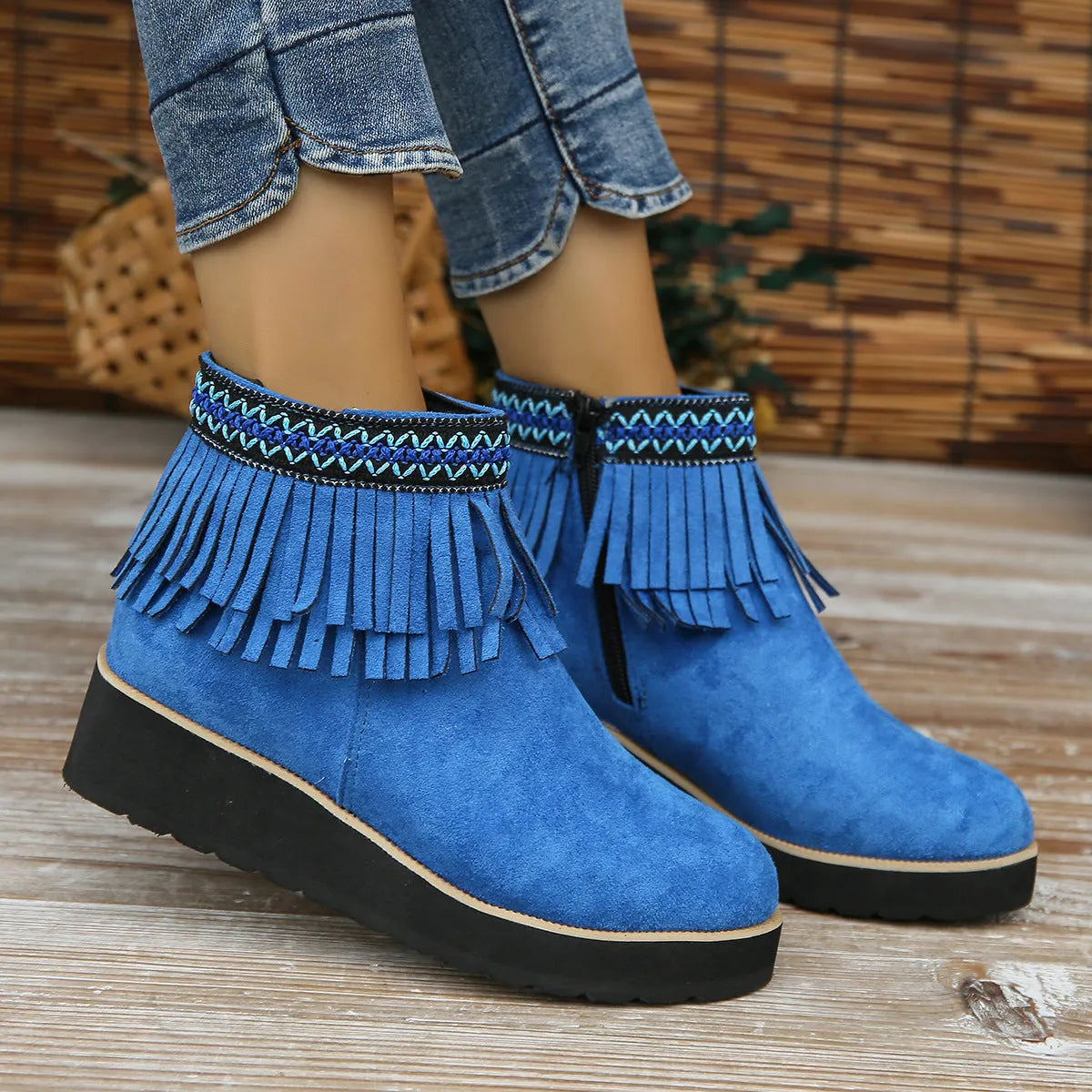 Women's suede wedge ankle boots with side zipper, thick rubber sole, and tassel detailing in dark brown colour