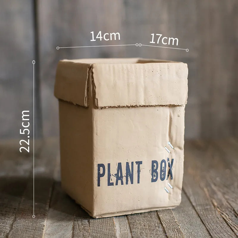 Cement flowerpot with perforated base and Nordic brown paper box design