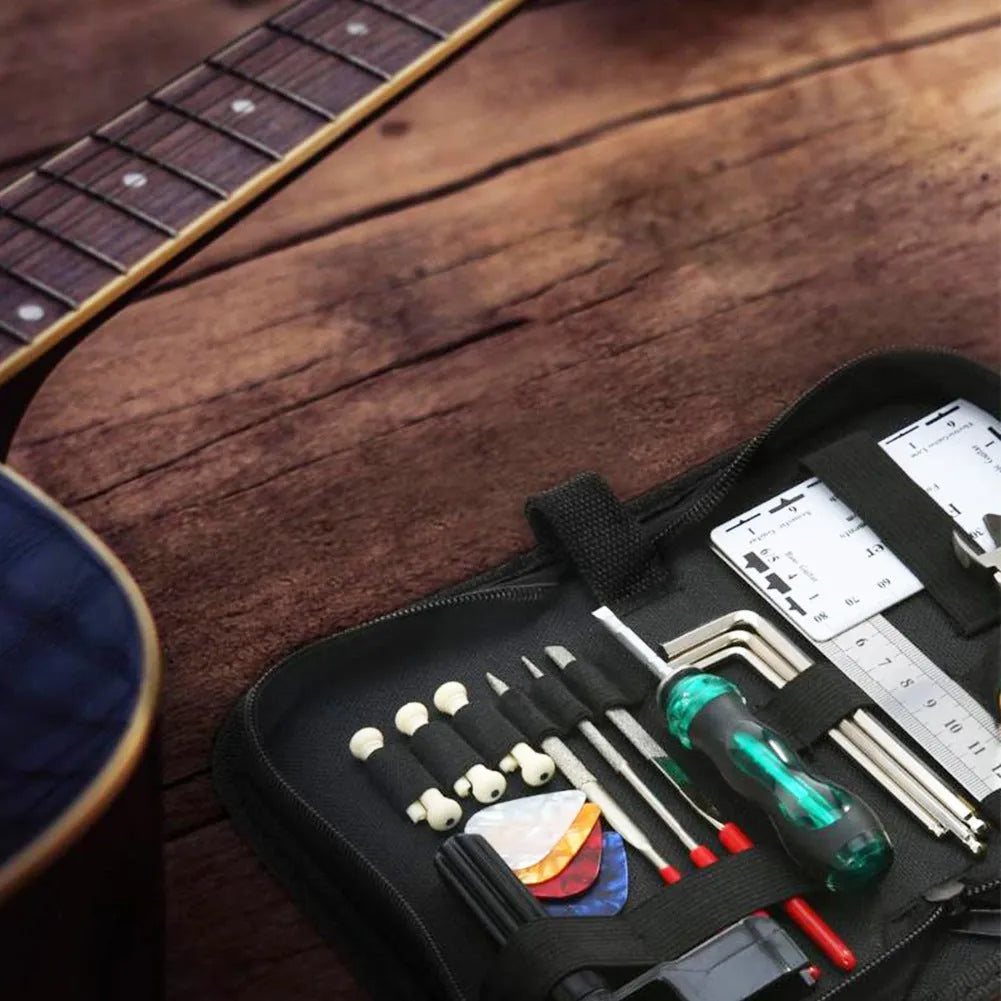 Black plastic case open to show guitar repair and maintenance tools for guitars, basses, mandolins, and banjos.
