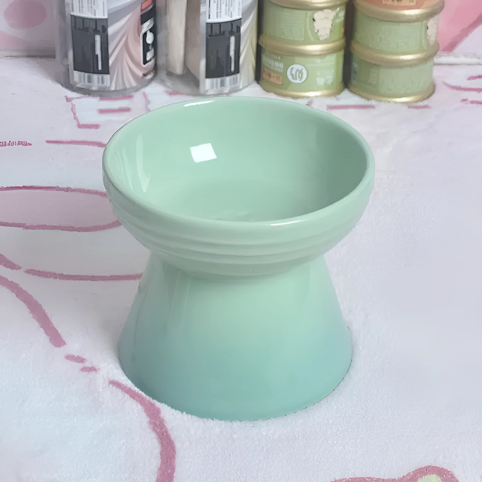 Black ceramic pet bowl with a high foot and neck protector to prevent tipping, shown with flat and slanted rim options.