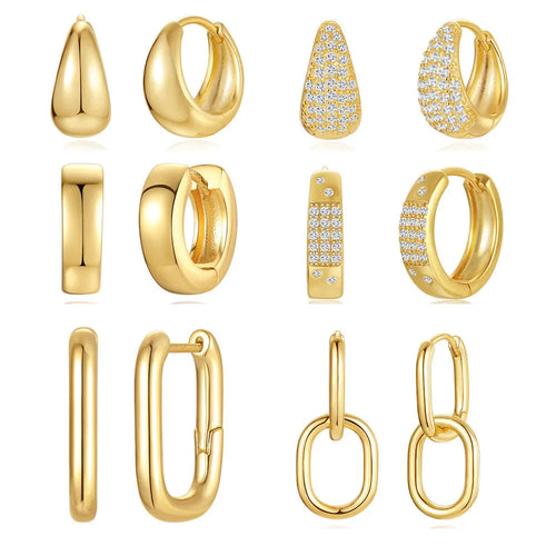 A pair of gold tone geometric earclip earrings with a round design and screw-back mechanism.