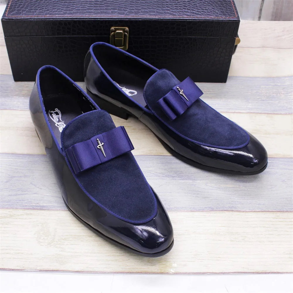 Men's glossy black patent leather low-top shoes with a tassel detail on a white background.