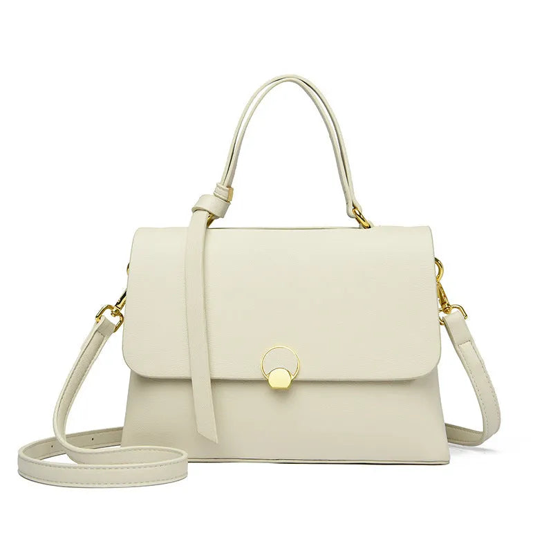 Soft PU cross-body handbag in beige, square vertical shape with sewing line detail, on white background