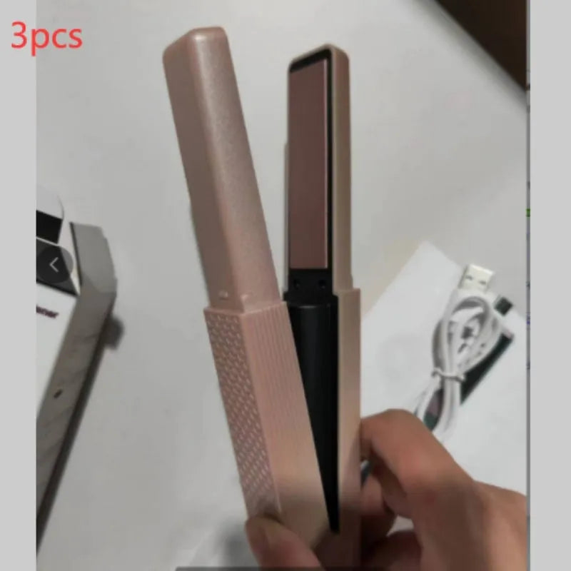 Pink and green mini cordless USB hair straightener with ceramic plates open on a white background.