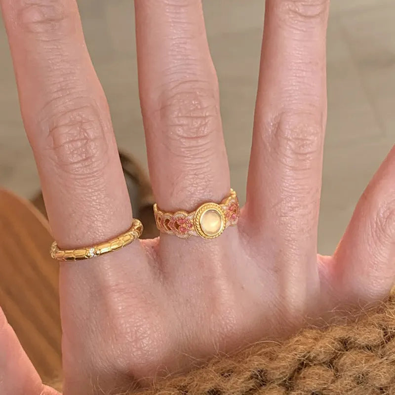 Geometric open-mouth ring with pink crystal enamel decoration on gold-plated copper band