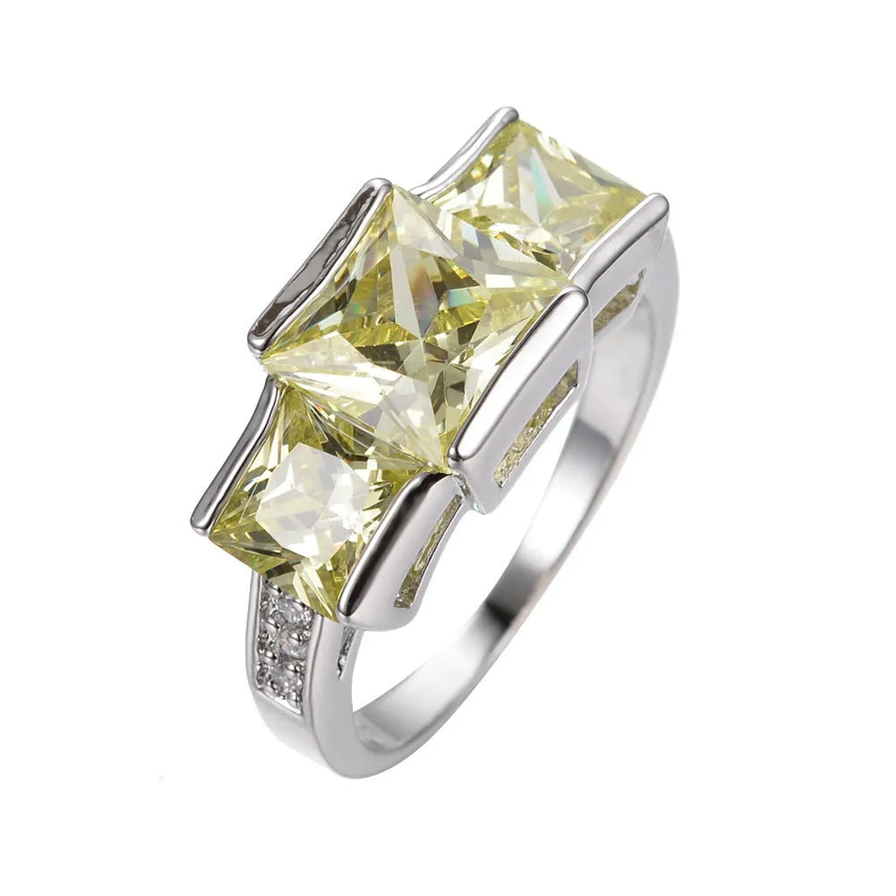 Geometric wholesale ring ornament in electroplated copper showing multiple colour options on a size 8 finger