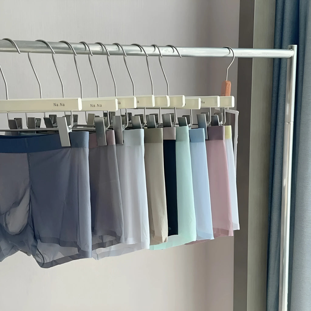 Ultra-thin antibacterial seamless men's boxers in honeycomb fabric on a colour swatch background.