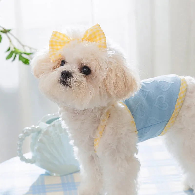 Small dog wearing heart bow suspenders vest in elastic polyester pet clothing