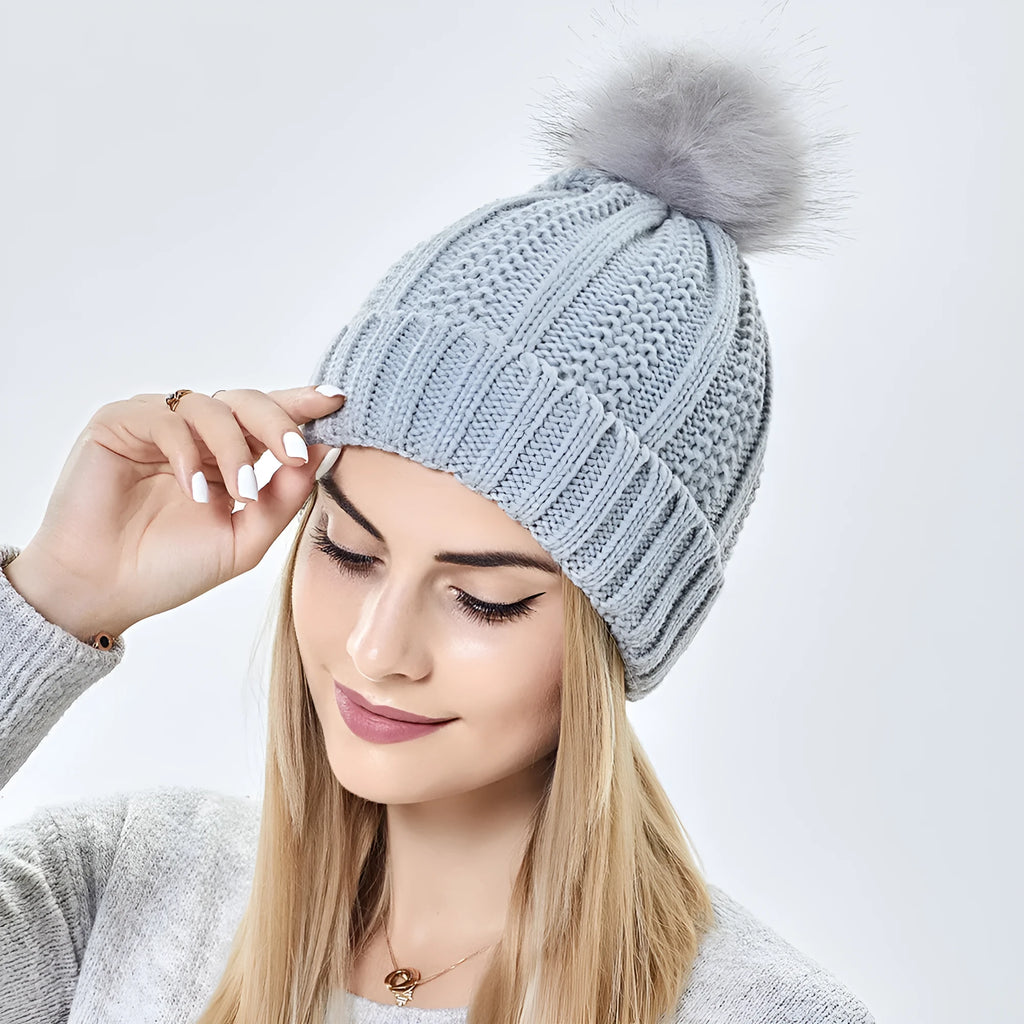 Women's knitted beanie hat with satin lining and faux fur pom pom in various colours