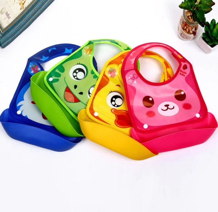 Cartoon baby PVC three-dimensional bib with blue koala pattern, silicone pocket and cotton cloth section on white background