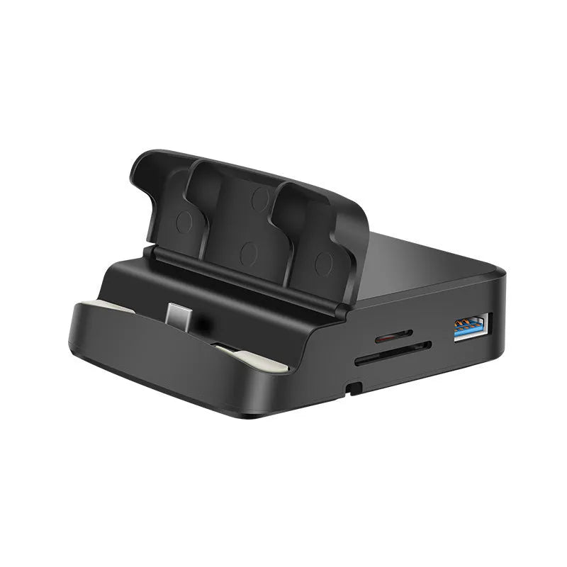 Black USB-C docking station with integrated bracket stand for laptops, featuring USB and HDMI ports, on a desk