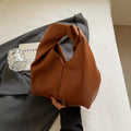 Casual dumpling-shaped women's PU shoulder bag in multiple colours showing internal phone and file pockets.