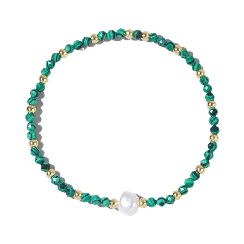 Close-up of a unisex natural stone bracelet with geometric ellipse beads on a wrist.