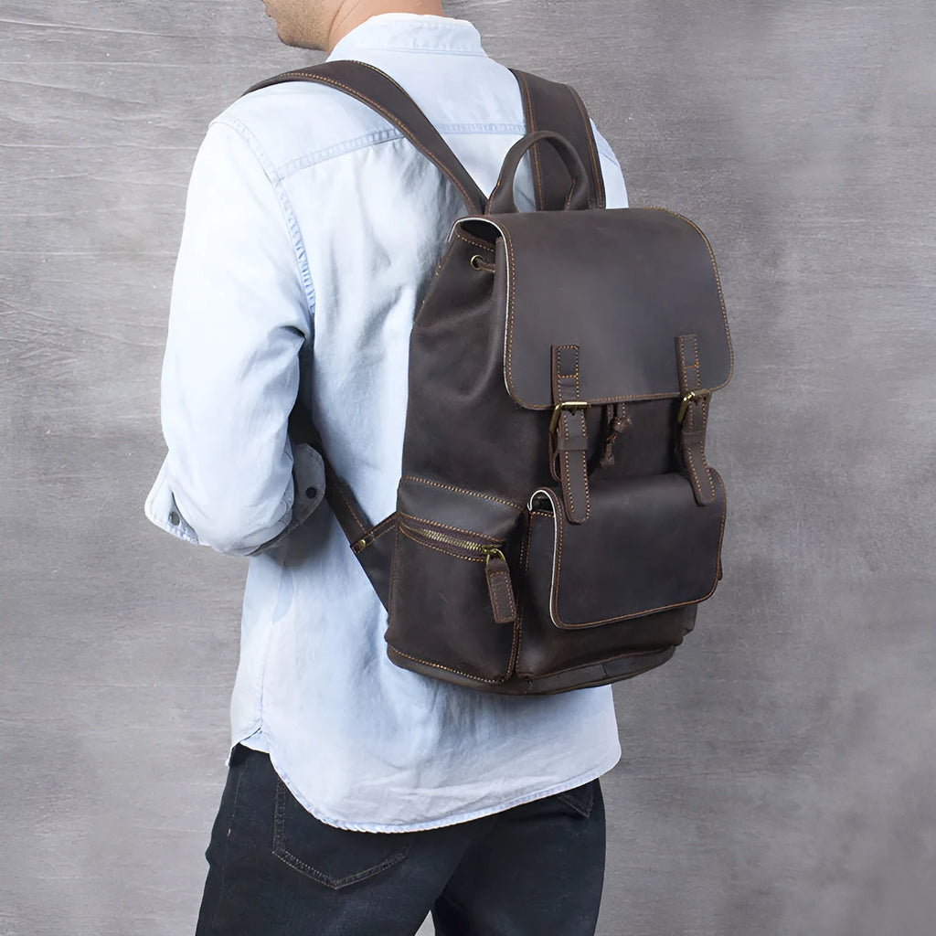 Brown genuine cowhide leather backpack with double shoulder straps and soft handle
