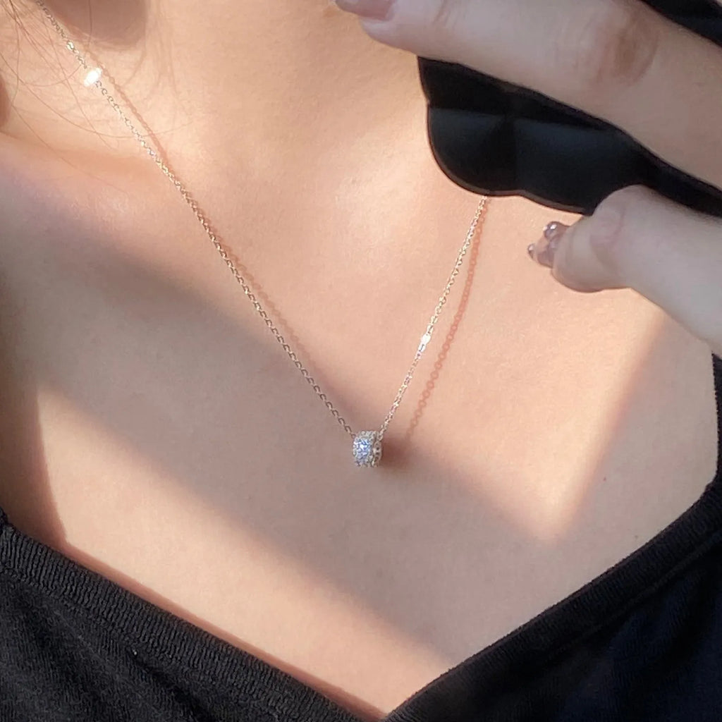 925 silver necklace with small waist pendant and platinum electroplate finish on white background