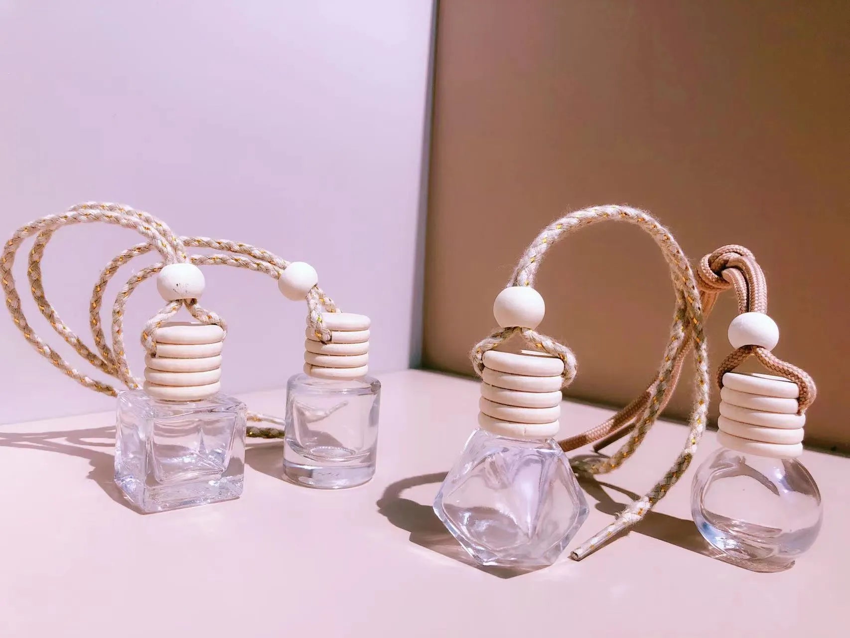 Glass car perfume pendant fragrance showing cylinder, diamond, flat drum and square container style options