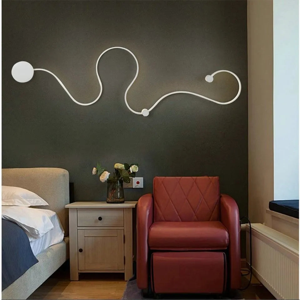 Modern LED wall lamp with aluminium shade in black finish, wall-mounted design for bedroom or corridor lighting