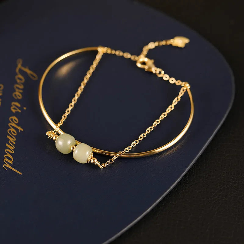 Women's jade lucky beads bracelet with gold inlay treatment in single, double, and three bead styles.