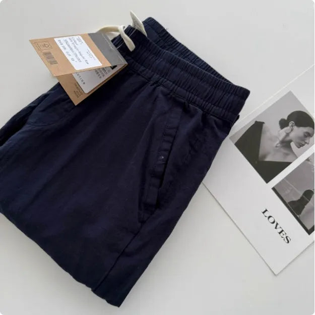 Men's loose straight casual pants in beige colour with drawstring waist detail for summer wear