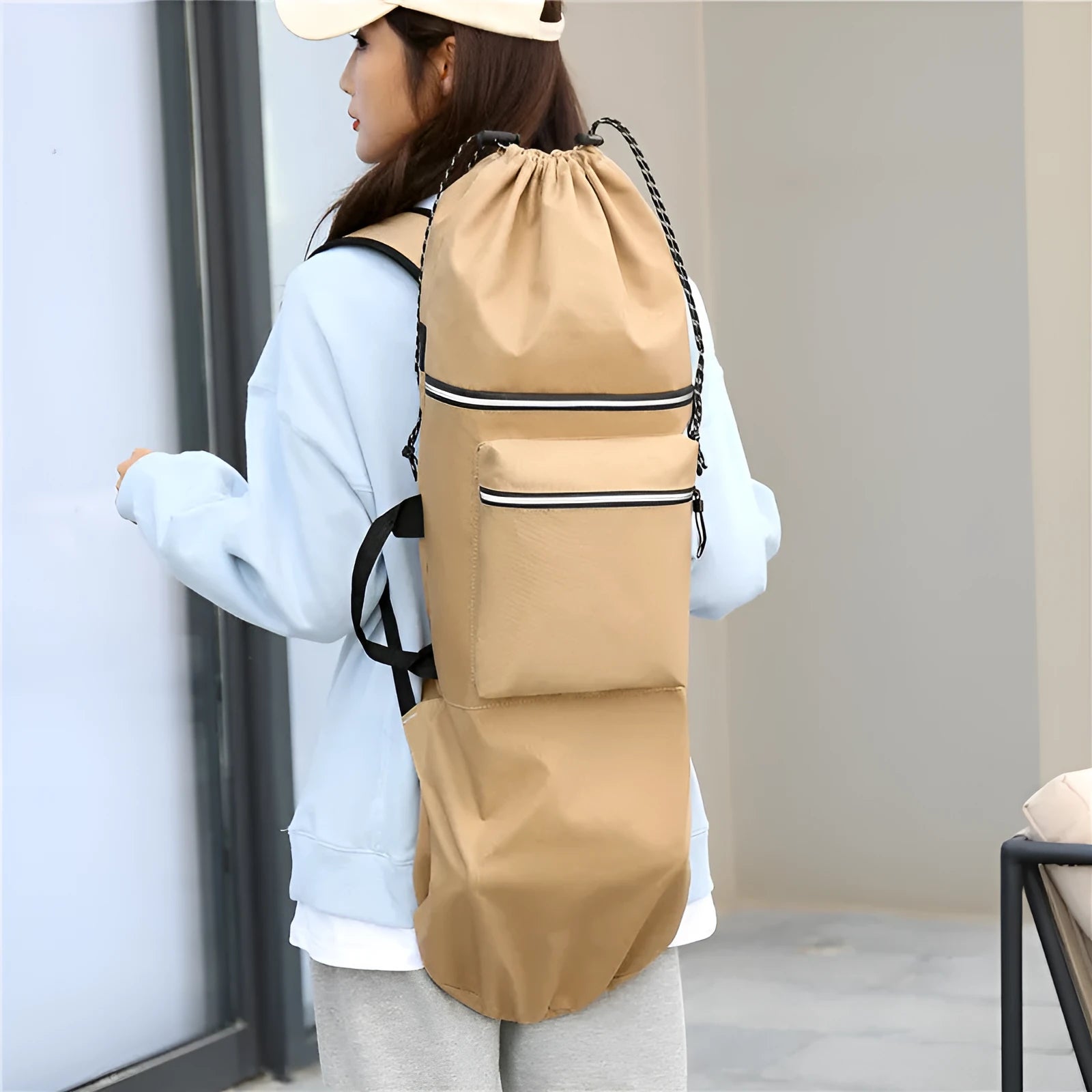 Lightweight waterproof nylon skate backpack in camouflage colour, shown with skateboard and fishing rod.