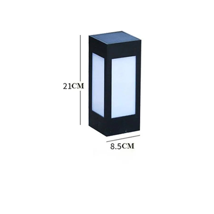 A set of waterproof solar-powered garden lights installed along a lawn edge and wall.