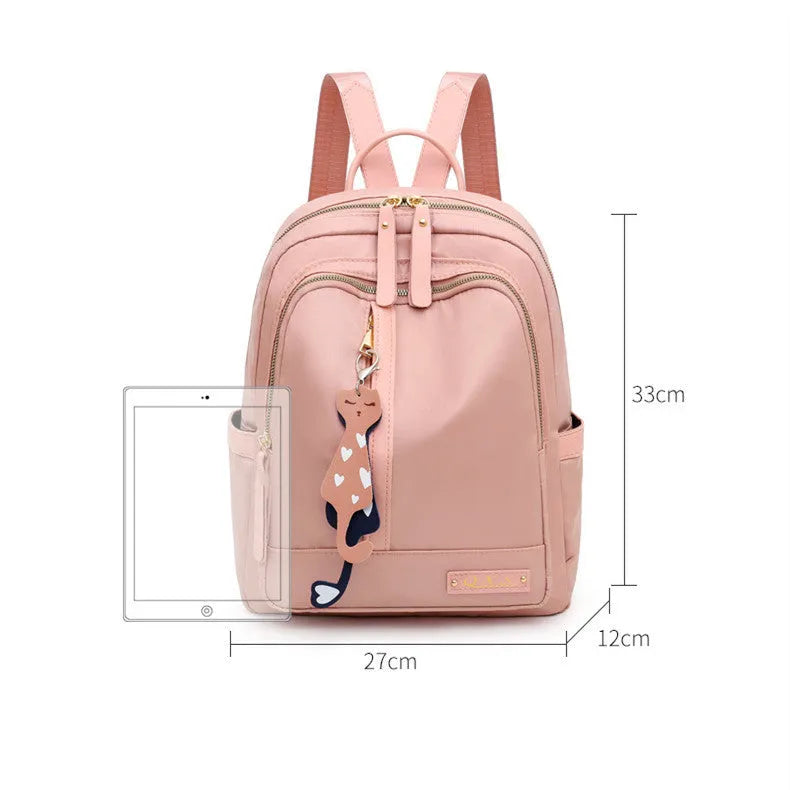 Black nylon casual backpack with square vertical shape, soft handle, and three-dimensional outer pocket