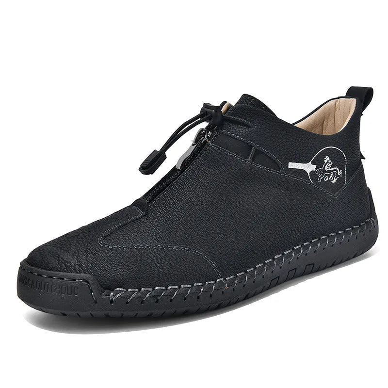 Casual men's leather travel shoes in black with rubber sole, mid heel, and round toe