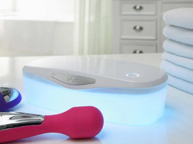 Compact white DORR UV disinfection box with USB cable for sanitising phones and small items.