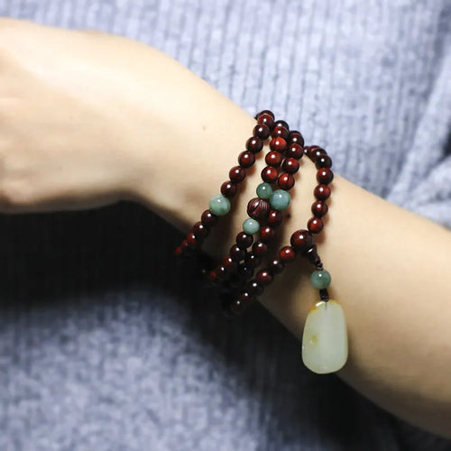 Rosewood beaded bracelet with 108 6mm beads and carved Hotian jade pendant centrepiece